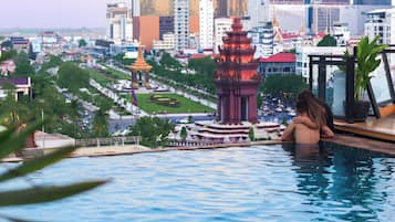 Outdoor pool, open 6:30 AM to 11:00 PM, pool umbrellas, sun loungers