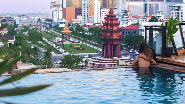Outdoor pool, open 6:30 AM to 11:00 PM, pool umbrellas, pool loungers