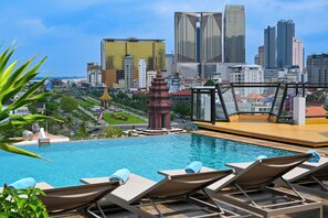 Outdoor pool, open 6:30 AM to 11:00 PM, pool umbrellas, pool loungers