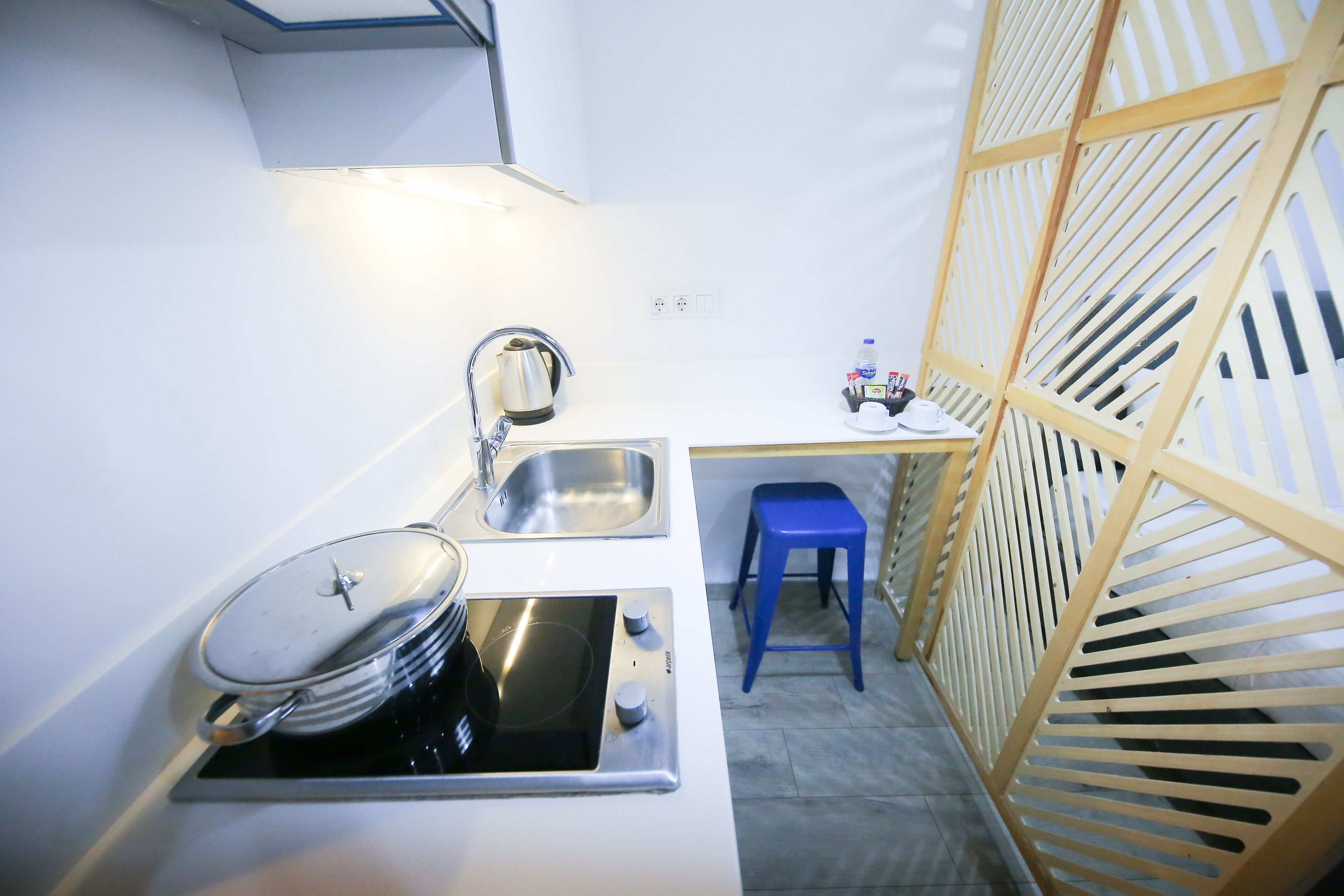 grand studio | private kitchenette | full-sized fridge, stovetop, cookware/dishes/utensils, paper towels