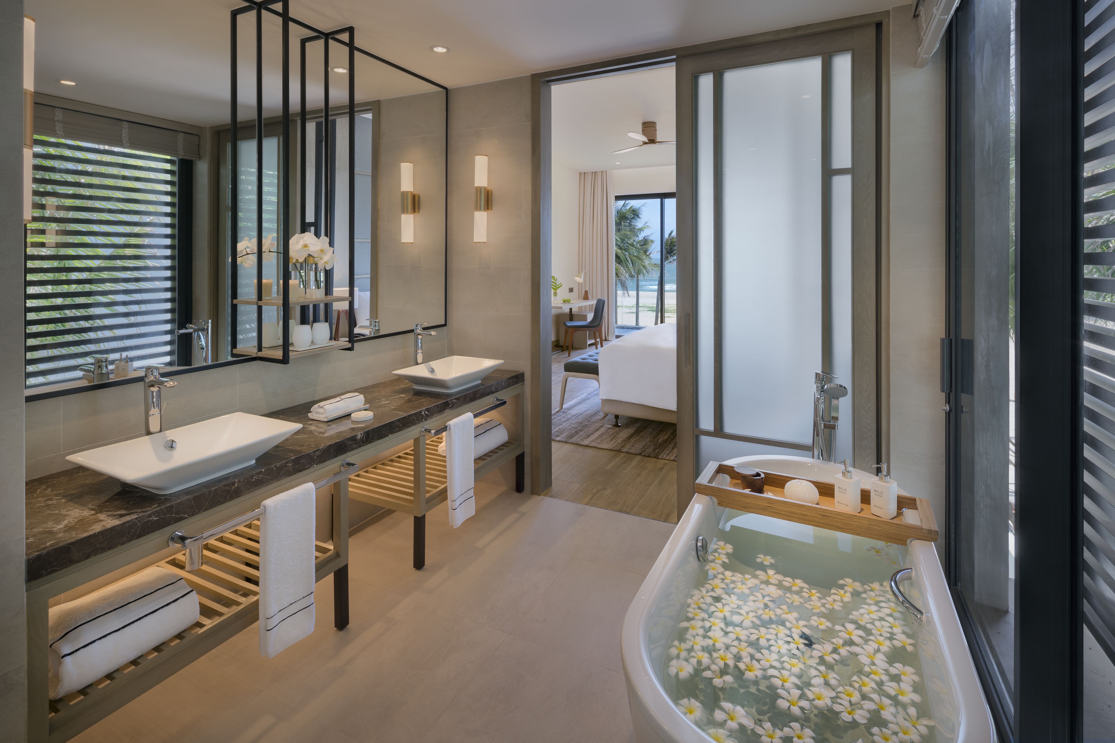 the level 4-bedroom beachfront pool villa | bathroom | eco-friendly toiletries, hair dryer, bathrobes, slippers