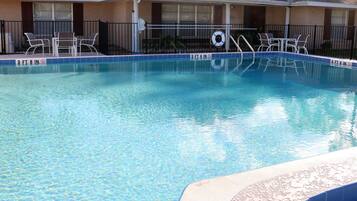 Outdoor pool, open 9:00 AM to 8:00 PM, pool umbrellas, pool loungers