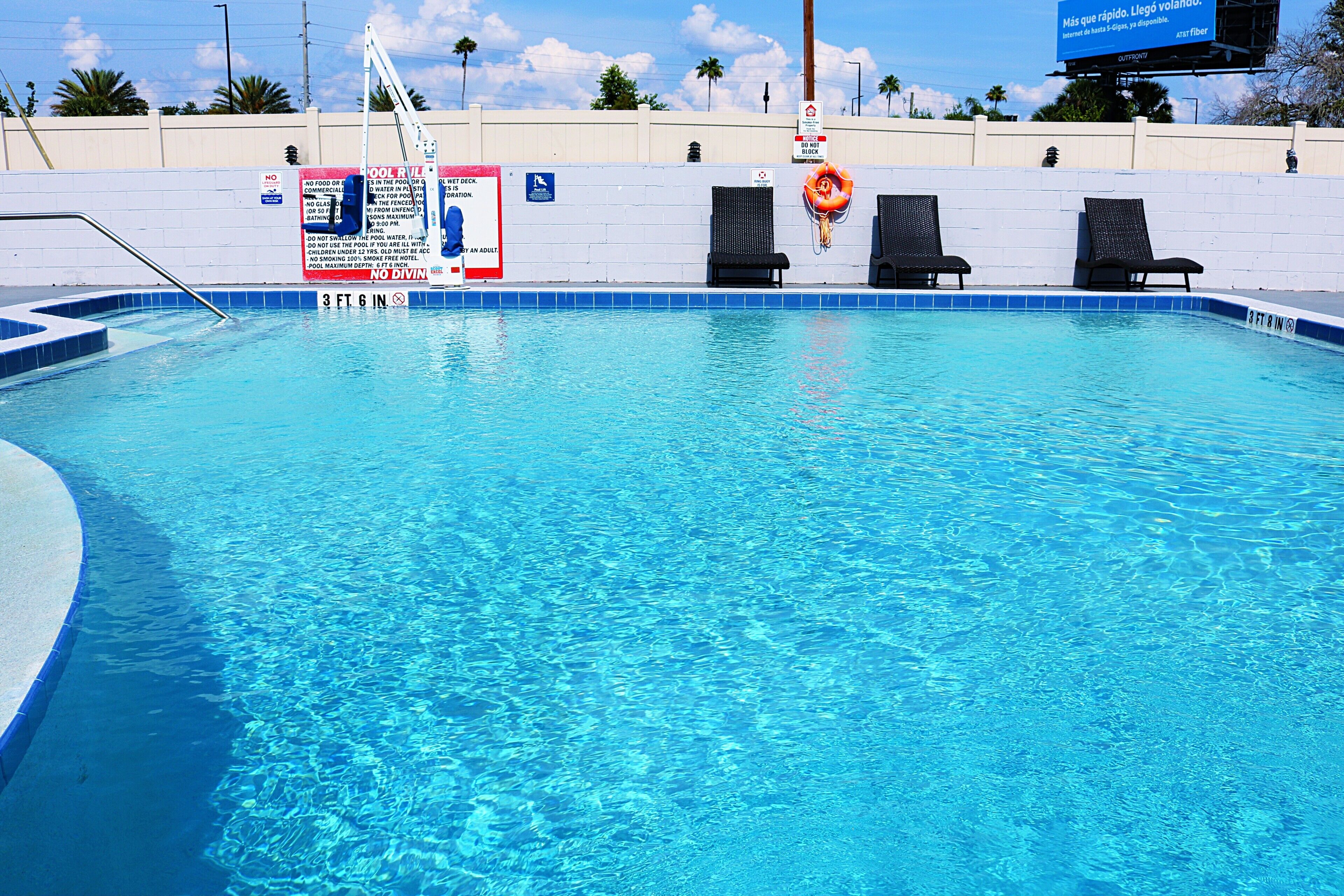 outdoor pool, open 9:00 am to 8:00 pm, pool umbrellas, pool loungers