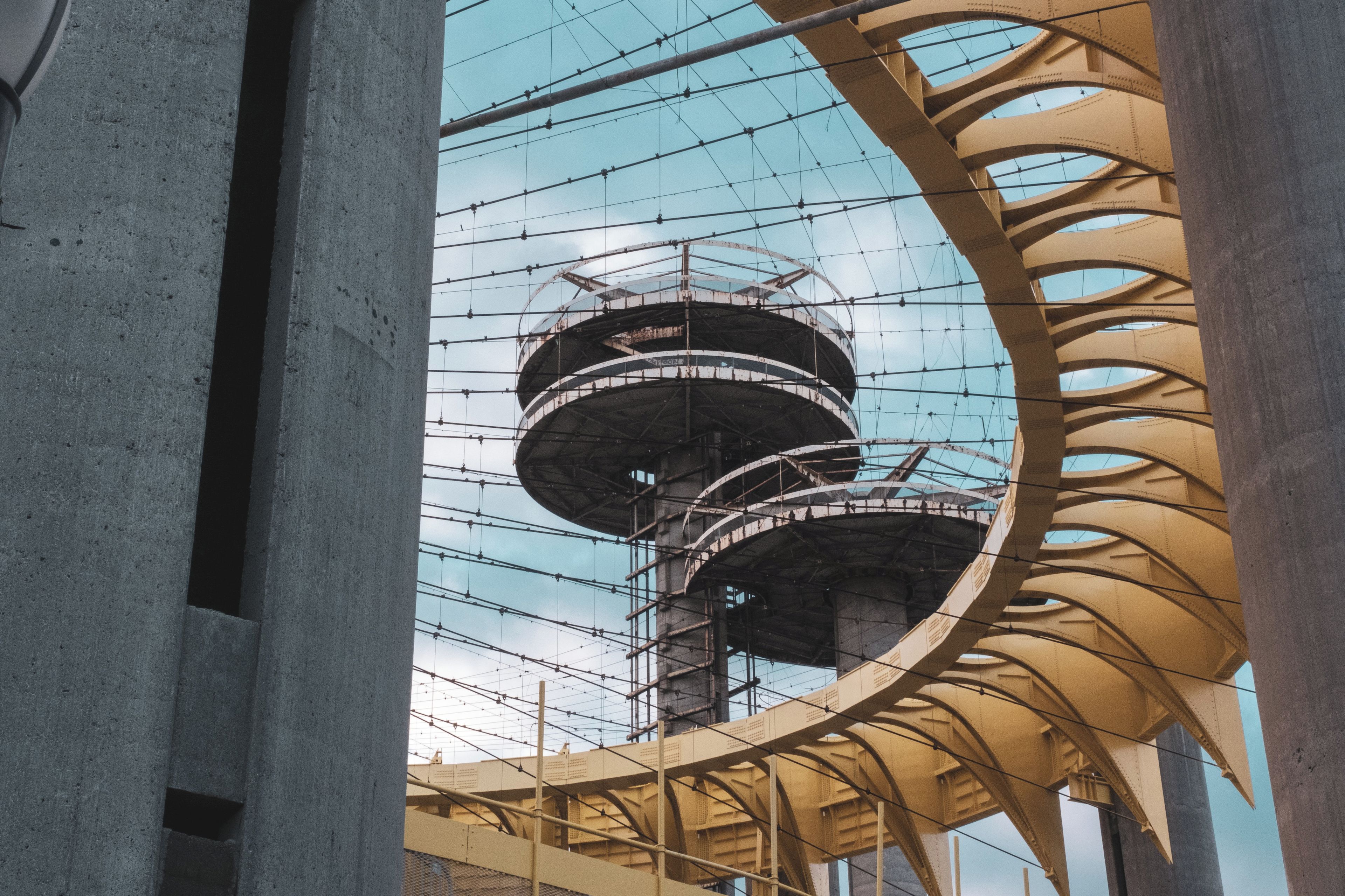 A multi-level structure with a complex network of cables and beams, possibly part of a large industrial or architectural installation.