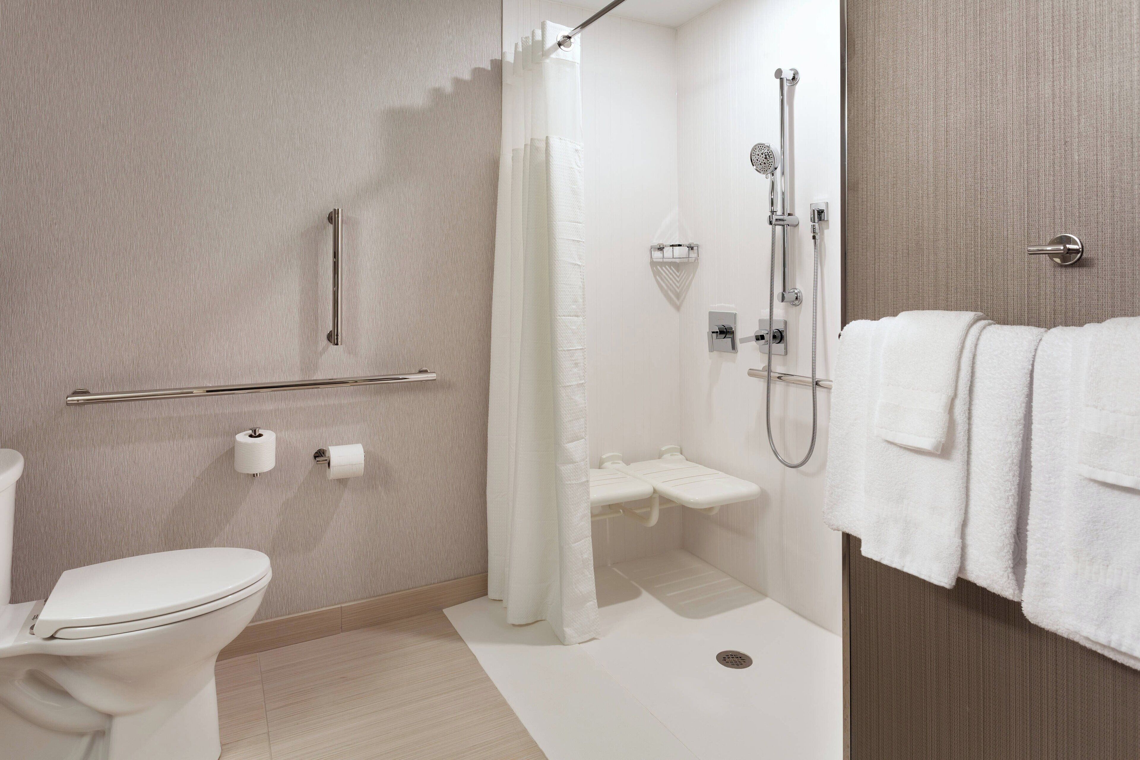 room, 2 queen beds (mobility accessible, roll-in shower) | bathroom | hydromassage showerhead, hair dryer, towels