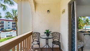 Outdoor dining - Coastal Escape - Beachfront 2BR w/ Pools, Tennis & Free Local Attractions (St. Augustine)