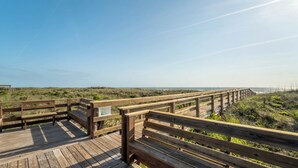 A wooden boardwalk leading to a beach with a clear sky. - Poolside 2BR Condo in Oceanfront Resort - Sleeps 6, Steps to Beach (St. Augustine)