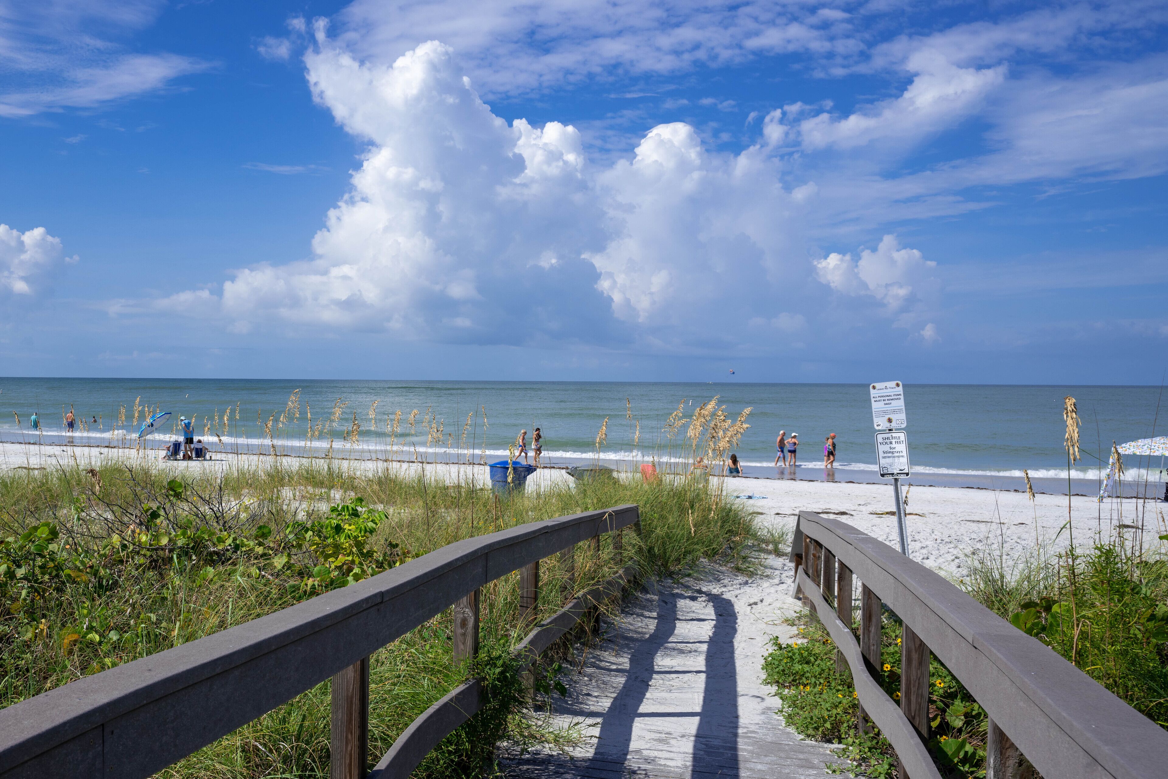 Beach nearby, white sand, beach towels