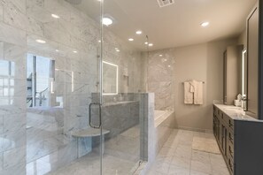 Combined shower/tub, hair dryer, towels, soap