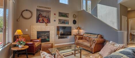 Smart TV, fireplace, books, stereo