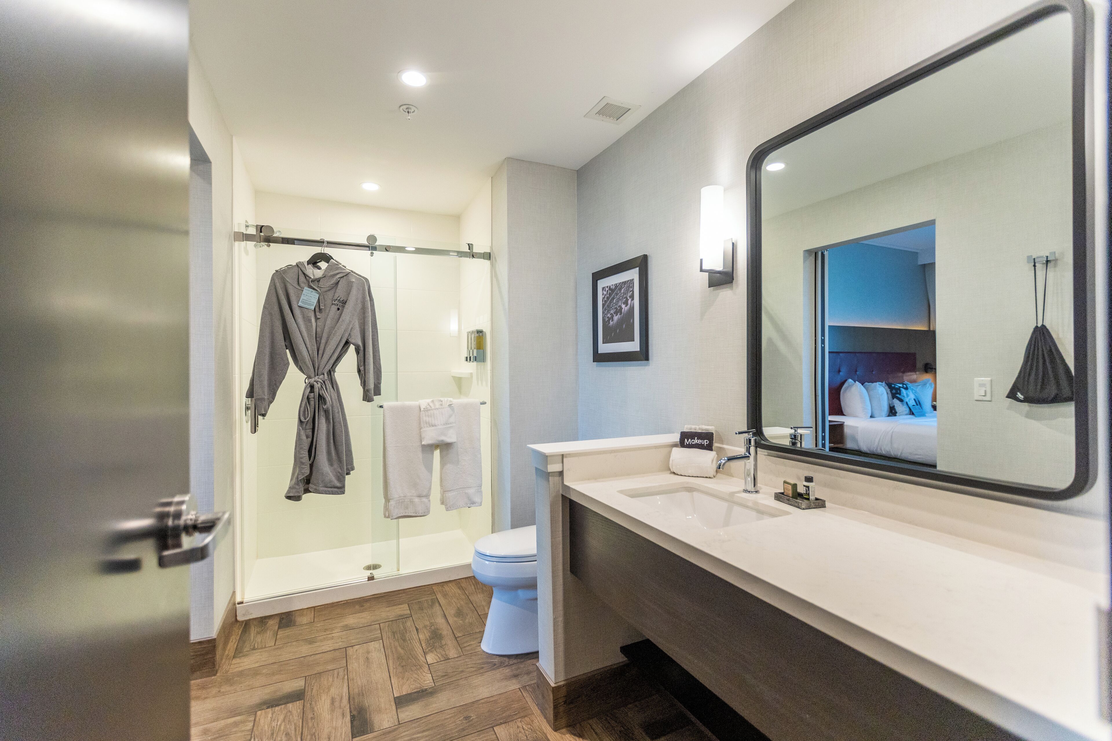 designer toiletries, hair dryer, towels