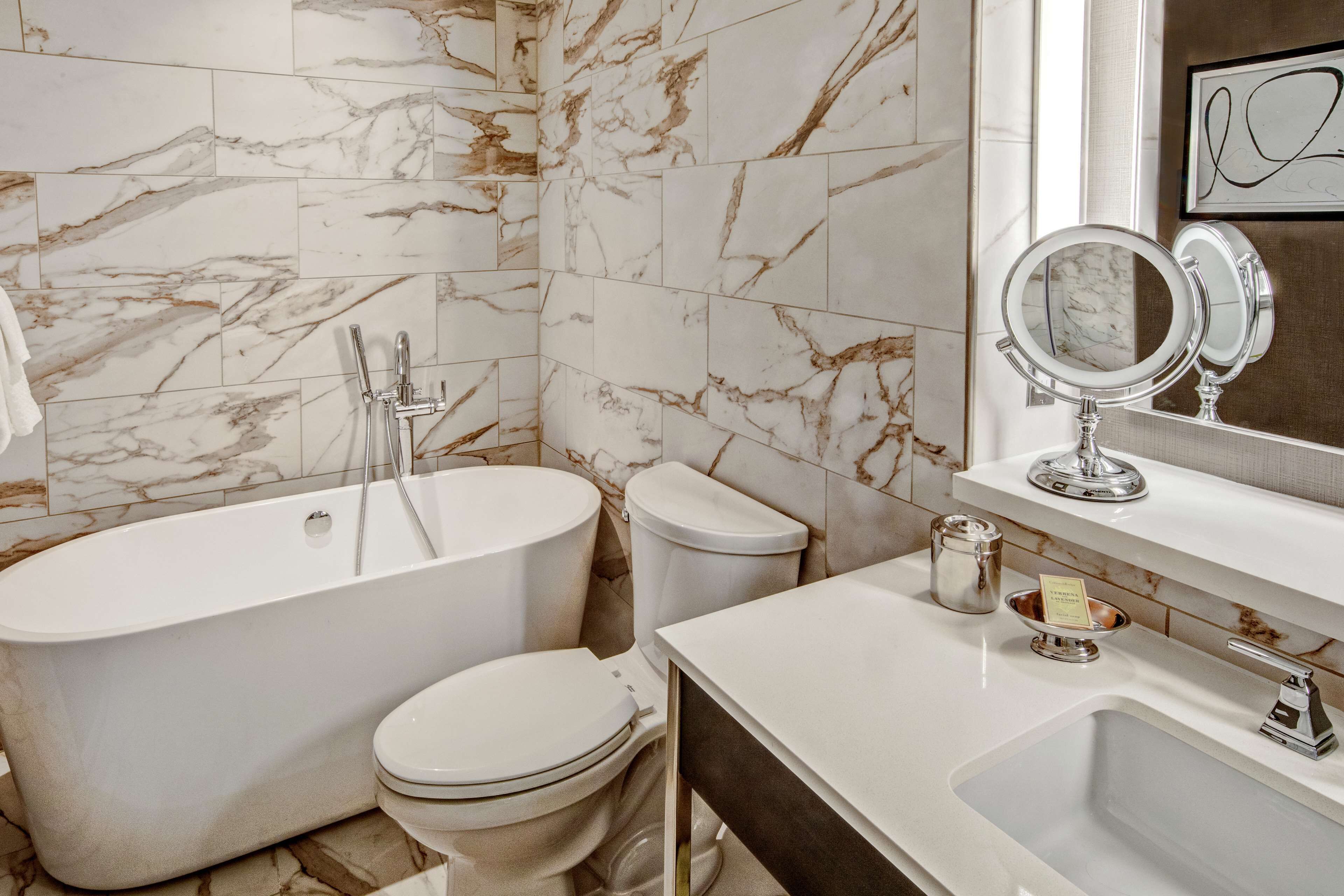 designer toiletries, hair dryer, towels, soap