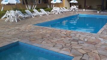 Outdoor pool, pool umbrellas, sun loungers