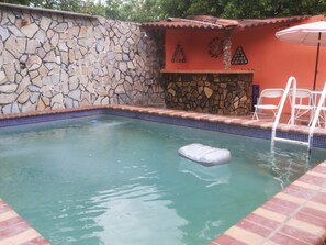 Outdoor pool, pool umbrellas, pool loungers