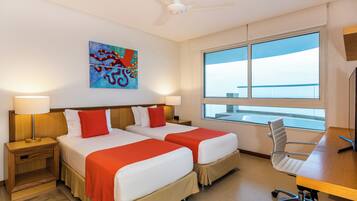 Deluxe Suite, 2 Bedrooms, Sea View | Premium bedding, in-room safe, individually furnished, desk