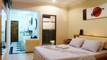 Suíte standard | Frigobar, Wi-Fi de cortesia, roupa de cama