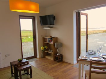 Kitchen/living room with views of fields, Atlantic ocean and mountains