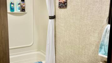 Combined shower/tub, hair dryer, towels, soap