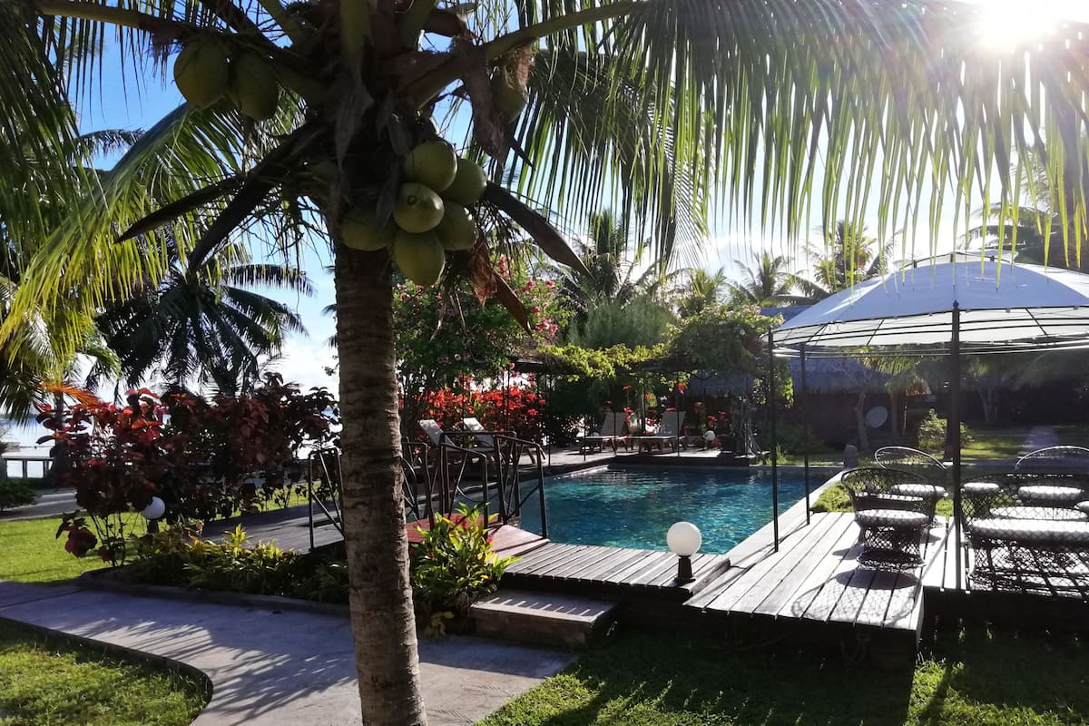 Traditional Bungalow, Pool View | 1 bedroom, pillowtop beds, minibar, in-room safe