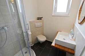A bathroom with a shower, toilet, and sink. - Villa Danica - Apartment (studio) 2 persons - direct at sea - 4 star (Betina)