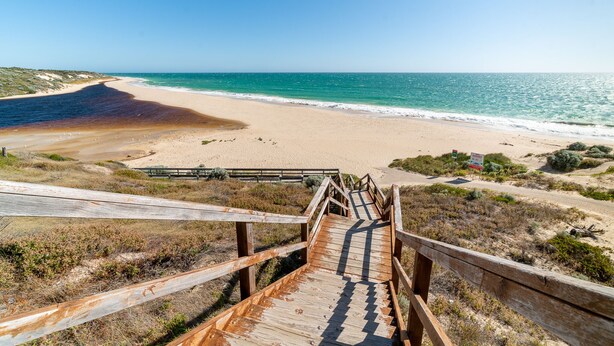 A wooden boardwalk leading to a beach with clear skies. - Ocean View Retreat - Best Views in town (Guilderton)