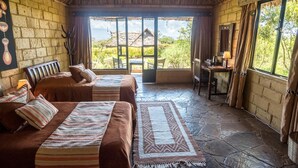 A room with two beds, a desk, and a large window. - Rhino Watch safari Lodge (Nyahururu)