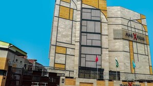 A building with a modern architectural design, featuring a prominent 'AVARI X PRESS' sign. - Avari Xpress Multan (Multan)