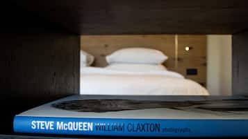 A book titled 'Steve McQueen William Claxton photographs' placed on a shelf.