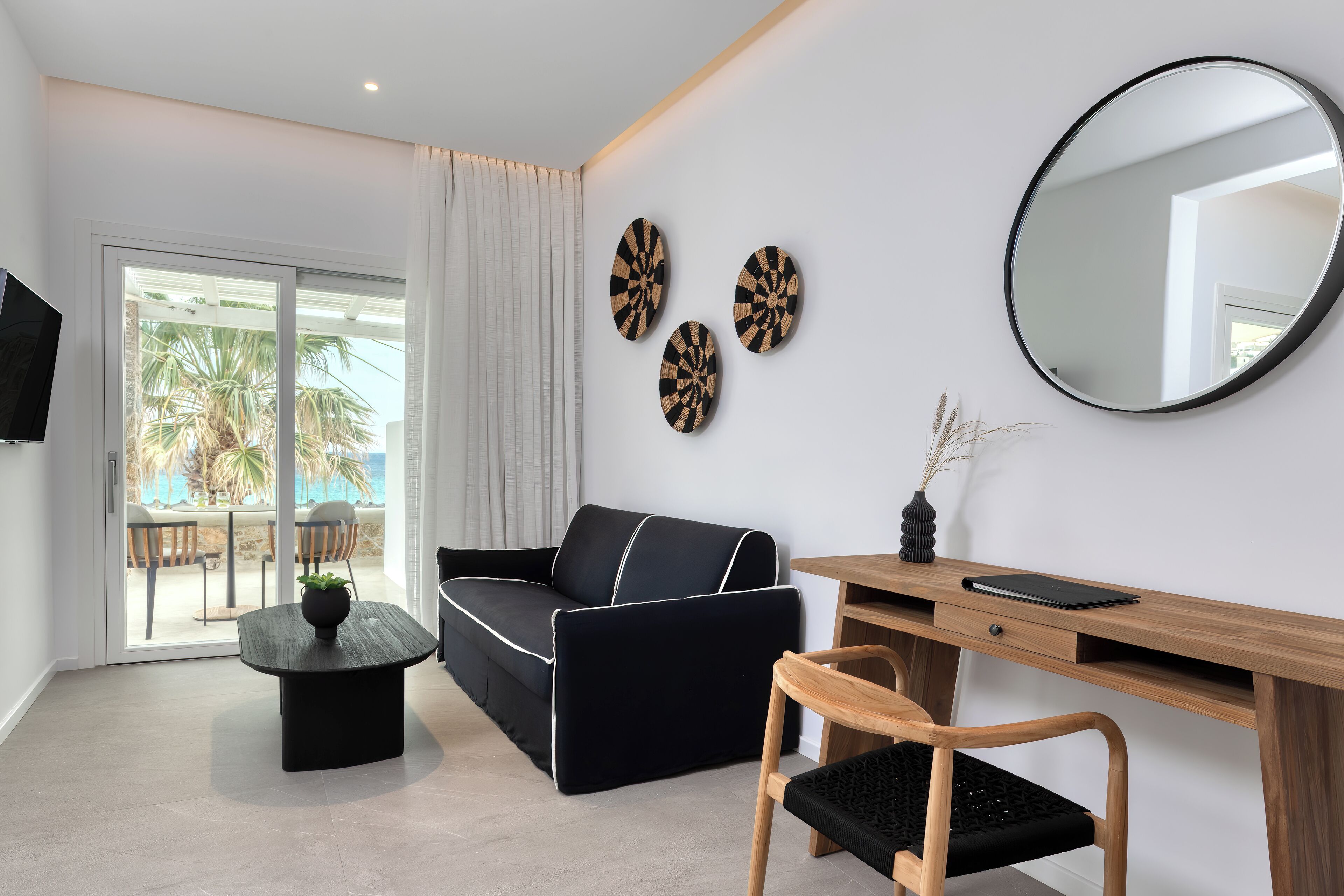 luxury apartment, 1 bedroom, sea view, beachfront | living area | flat-screen tv