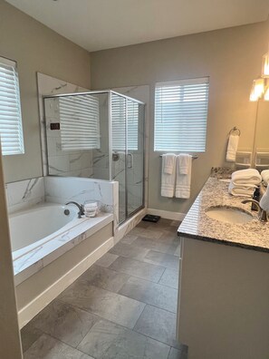 Combined shower/tub, hair dryer, towels, soap