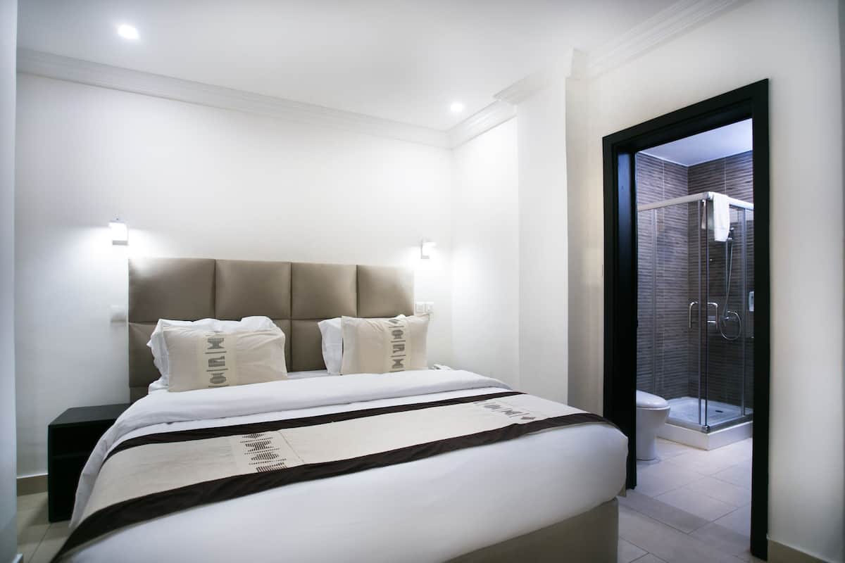 Premium Suite, 2 Bedrooms | Desk, blackout curtains, soundproofing, iron/ironing board