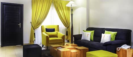 Superior Suite, 2 Bedrooms, Accessible, City View | Living area | Plasma TV