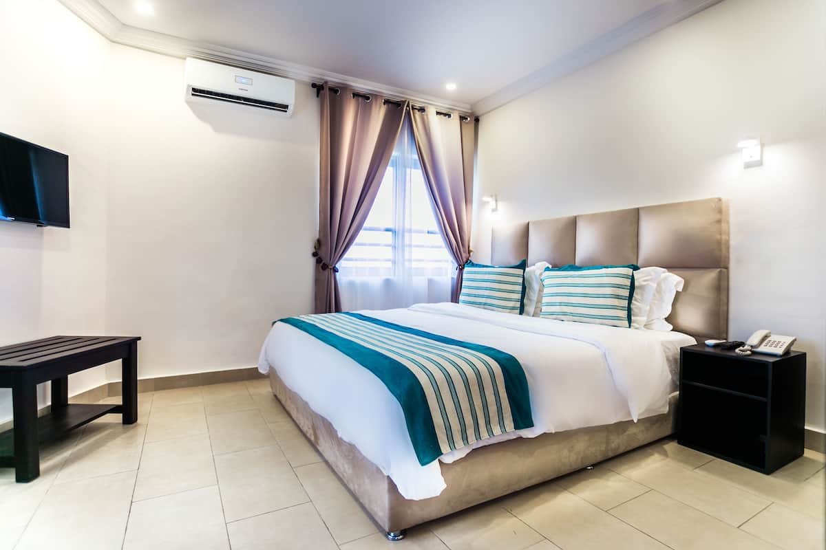 Superior Suite, 2 Bedrooms, Accessible, City View | Desk, blackout curtains, soundproofing, iron/ironing board