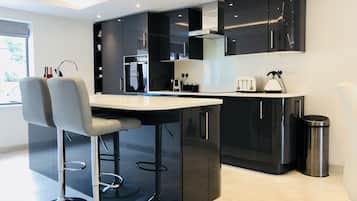 The Leat Apartment, 2 Bedroom, En-Suite | Private kitchen | Full-sized fridge, microwave, oven, dishwasher