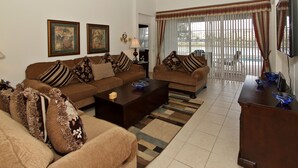 Premium Villa (5 beds) | Living area | Flat-screen TV - Kissimmee Vacation Homes (Kissimmee)