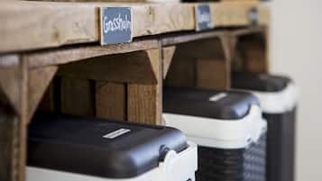 A row of trash bins with labels, including one labeled "Grassholm."