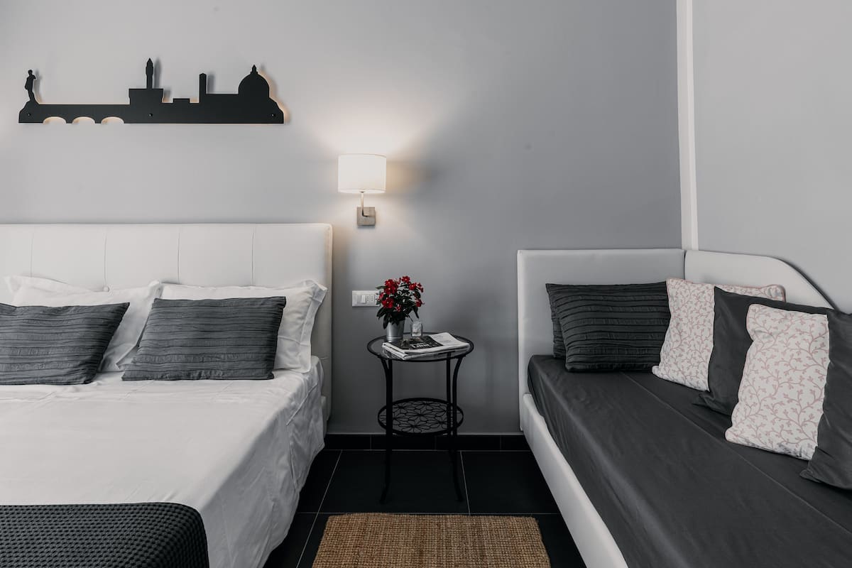 Deluxe Triple Room, 1 Bedroom, Balcony | 4 bedrooms, Frette Italian sheets, hypo-allergenic bedding