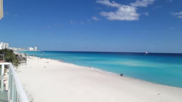 On the beach, sun-loungers, beach umbrellas, beach towels