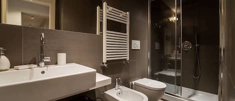 Shower, eco-friendly toiletries, hair dryer, bidet