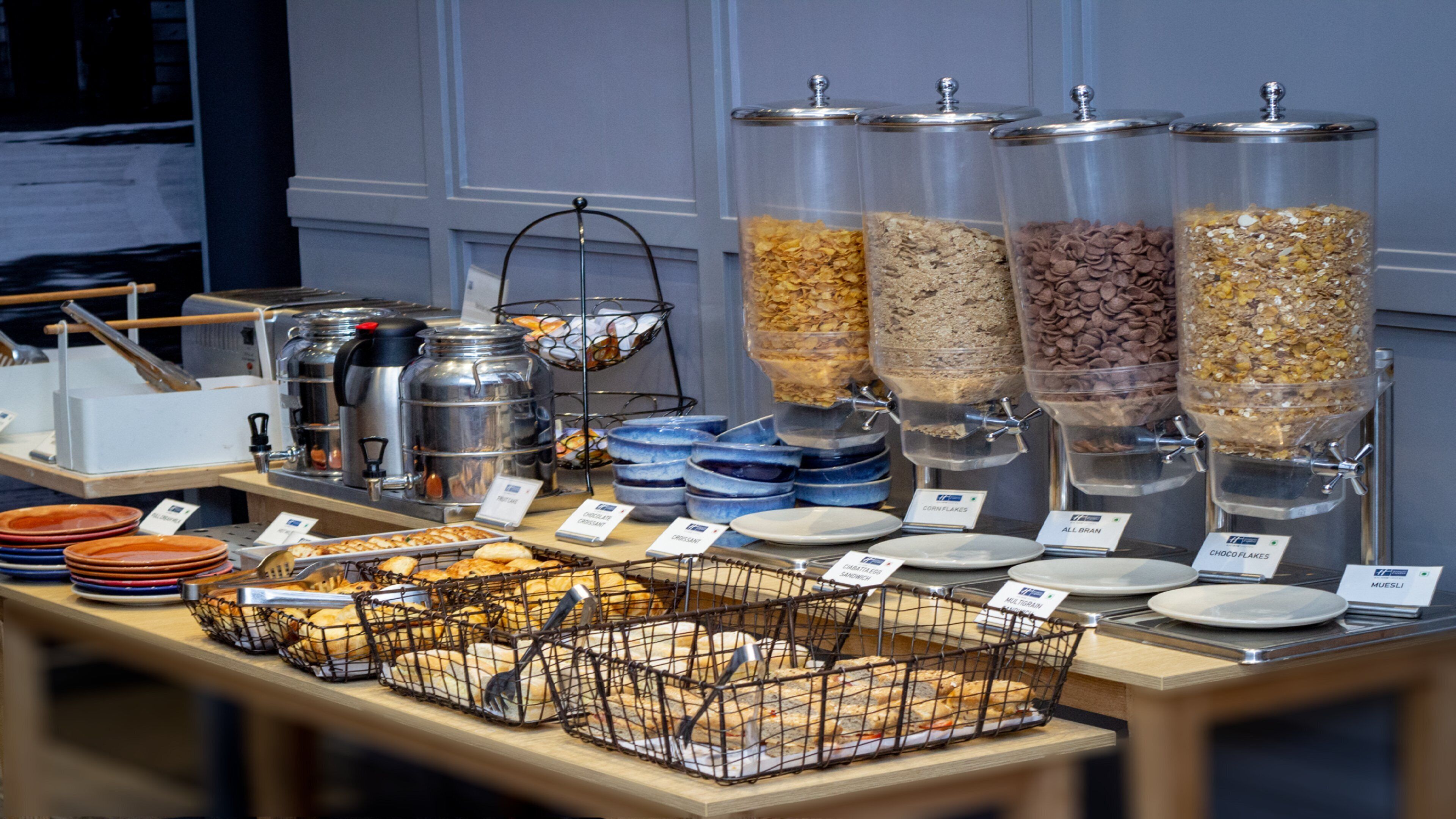 A buffet setup with various food items and serving stations.
