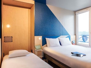 Triple Room, Multiple Beds | Hypo-allergenic bedding, desk, laptop workspace, blackout drapes