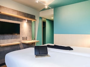 Hypo-allergenic bedding, desk, laptop workspace, blackout curtains