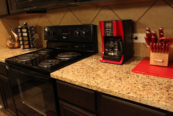 A kitchen with a stove, oven, microwave, and coffee maker. - Beautiful and cozy home near Sea World 4 mi, Lackland 8 miles, Six Flags14 mi (San Antonio)