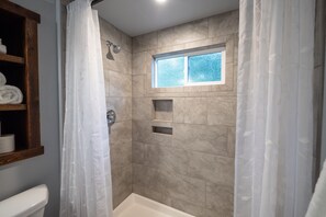 Combined shower/tub, hair dryer, towels, soap