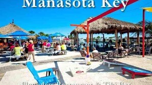 A beachside restaurant and tiki bar named 'Manasota Key' with outdoor seating and umbrellas. - Bay Waterfront Mermaid's Retreat Delights! Great suite on desirable Manasota Key! (Englewood)