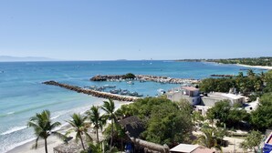 A coastal town with a marina, beach, and residential buildings. - Farito Beachfront Penthouse, Surf & Paddle Board. (Punta de Mita)