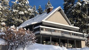 A two-story building with a covered porch and a snow-covered roof. - PACK YOUR BAGS & LET THE ADVENTURES BEGIN! SLEEPS 10, HOT TUB, & PET FRIENDLY (Pagosa Springs)