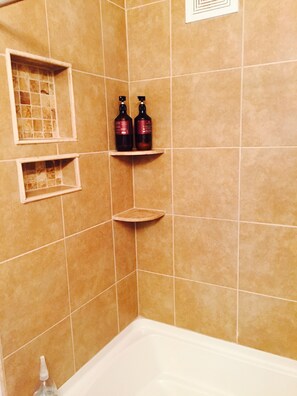 Shower, hair dryer, towels, shampoo