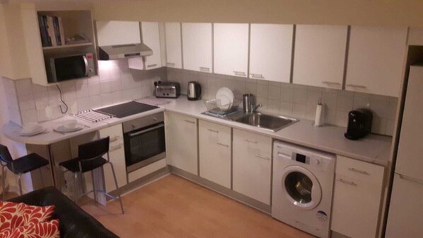 Microwave, coffee/tea maker, cookware/dishes/utensils