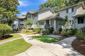 Stroll through a charming neighborhood lined with classic homes, each featuring a welcoming front porch and beautifully manicured lawns.